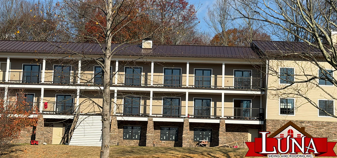 Roofing company in Fishkill, NY performing a detailed roof inspection
