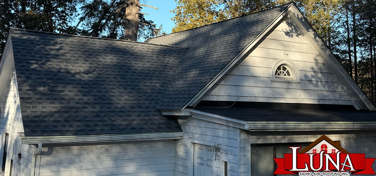 Roofing company in Hyde Park, NY performing a detailed roof inspection
