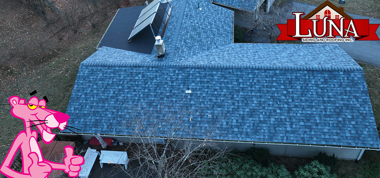 Roofing company in Wappingers Falls, NY assessing an active roof leak